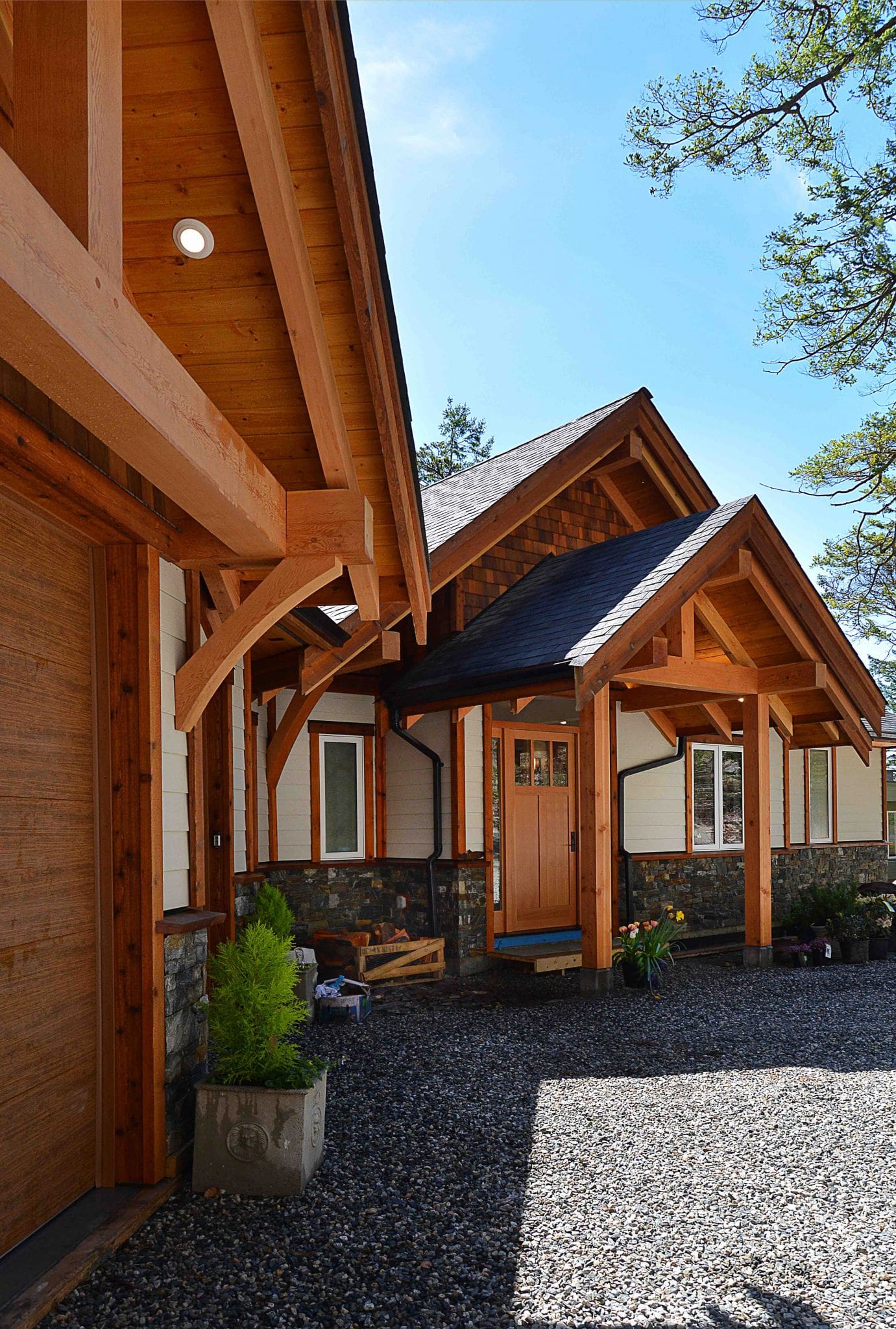 Pender Harbour Timber Frame Home | Streamline Design Ltd A sideview of the outside of a timber frame home
