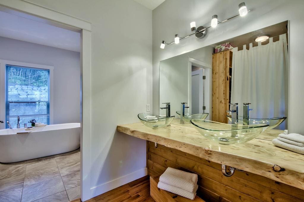 Timber Wolf Bed and Breakfast Timber Frame Design 5 | Streamline Design Ltd Master bathroom with wood accents