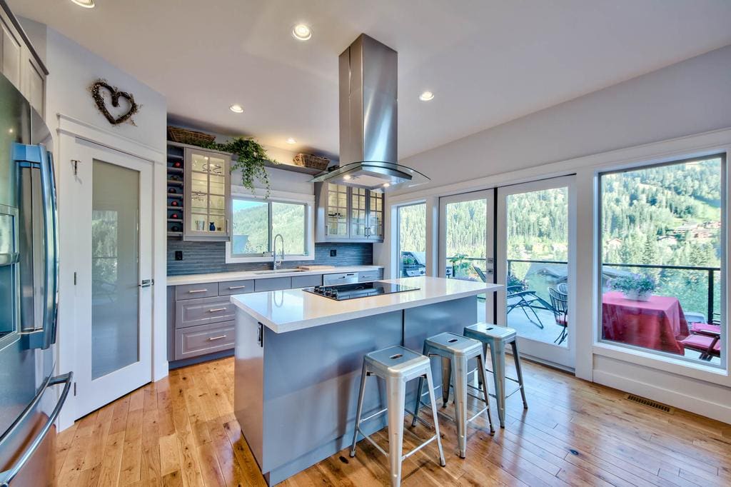 Timber Wolf Bed and Breakfast Timber Frame Design 6 | Streamline Design Ltd Modern kitchen with wood floor looking over a view of the hills